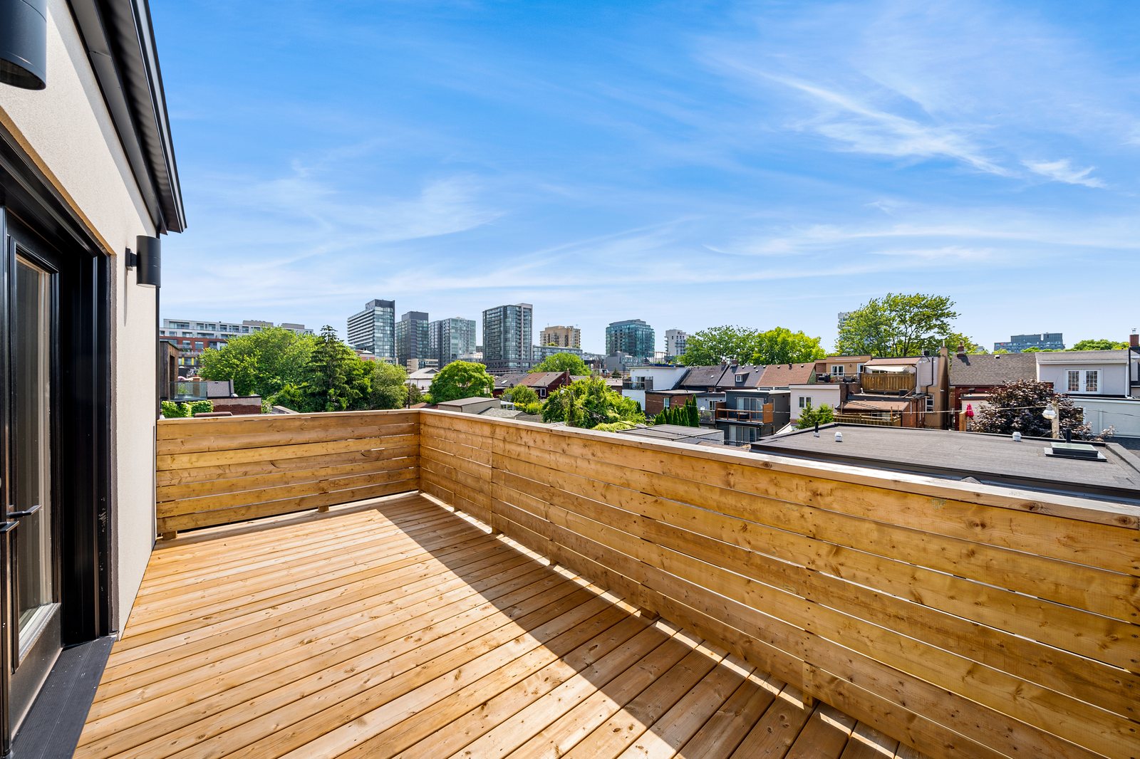 Private rooftop deck with Toronto skyline views at a Reside Properties multiplex
